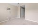 Spacious bedroom with neutral walls, carpet, and a walk-in closet at 2619 Redford Way, Wesley Chapel, FL 33544