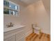 Simple bathroom with white vanity and toilet at 1107 Jackson Rd, Clearwater, FL 33755