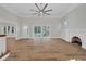 Living room with hardwood floors, fireplace, and plenty of natural light at 1107 Jackson Rd, Clearwater, FL 33755