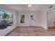 Sunroom featuring hardwood floors and large windows at 1107 Jackson Rd, Clearwater, FL 33755