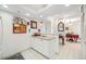 White kitchen with a breakfast bar overlooking the dining area at 1 Key Capri # 104E, Treasure Island, FL 33706