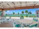 Relaxing patio area with tables and chairs with a beautiful water view at 1 Key Capri # 104E, Treasure Island, FL 33706