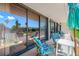Spacious patio with sliding glass doors and seating area at 1 Key Capri # 104E, Treasure Island, FL 33706