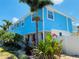 Charming blue house with lush tropical landscaping at 1826 58Th S St, Gulfport, FL 33707