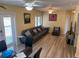 Bright living room featuring hardwood floors and access to a balcony at 1826 58Th S St, Gulfport, FL 33707