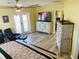 Bedroom with large TV and access to a balcony at 1826 58Th S St, Gulfport, FL 33707