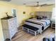 Spacious bedroom with king-size bed and bench at 1826 58Th S St, Gulfport, FL 33707