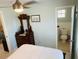 Bedroom with antique dresser and adjacent bathroom at 1826 58Th S St, Gulfport, FL 33707