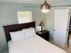 Guest bedroom with a queen bed and Tiffany lamp at 1826 58Th S St, Gulfport, FL 33707
