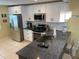 Modern kitchen with stainless steel appliances and granite countertops at 1826 58Th S St, Gulfport, FL 33707