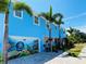Two-story light blue home with unique garage mural at 1826 58Th S St, Gulfport, FL 33707