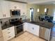 Updated kitchen with stainless steel appliances and an island at 1826 58Th S St, Gulfport, FL 33707