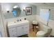 Clean bathroom, featuring a white vanity and oval mirror at 1826 58Th S St, Gulfport, FL 33707