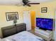 Bedroom with large TV and dresser at 1826 58Th S St, Gulfport, FL 33707