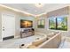 Relaxing theater room with comfortable seating and large screen TV at 31275 Spruceberry Ct, Wesley Chapel, FL 33543