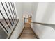 Modern staircase with dark wood flooring and metal railings at 31275 Spruceberry Ct, Wesley Chapel, FL 33543