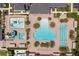 Community pool area with water features and lounge chairs at 31275 Spruceberry Ct, Wesley Chapel, FL 33543
