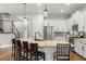 Modern kitchen with large island, stainless steel appliances, and granite countertops at 31275 Spruceberry Ct, Wesley Chapel, FL 33543