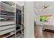 Large walk-in closet with ample shelving and hanging space at 31275 Spruceberry Ct, Wesley Chapel, FL 33543