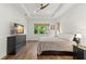 Bright bedroom with large window, hardwood floors, and ample space at 31275 Spruceberry Ct, Wesley Chapel, FL 33543