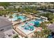 Aerial view of community pool with water features and a ' play area at 31275 Spruceberry Ct, Wesley Chapel, FL 33543