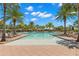 Inviting resort-style pool with plenty of lounge chairs at 31275 Spruceberry Ct, Wesley Chapel, FL 33543
