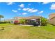 Large backyard with patio, lush landscaping, and privacy at 31275 Spruceberry Ct, Wesley Chapel, FL 33543