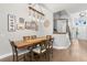 Dining room with wood table, chairs, and hardwood floors at 31275 Spruceberry Ct, Wesley Chapel, FL 33543