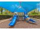 Covered playground with two slides, perfect for young children at 31275 Spruceberry Ct, Wesley Chapel, FL 33543