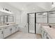 Elegant bathroom with double vanity, soaking tub, and walk-in shower at 31275 Spruceberry Ct, Wesley Chapel, FL 33543