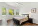 Bedroom with bay window, hardwood floors and ceiling fan at 31275 Spruceberry Ct, Wesley Chapel, FL 33543