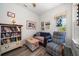 Relaxing living room with comfy seating and a bookcase at 20591 Monza Loop, Land O Lakes, FL 34638