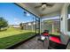 Spacious screened porch overlooking backyard and lake at 20591 Monza Loop, Land O Lakes, FL 34638