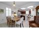 Charming dining area with kitchen views and wood table at 20591 Monza Loop, Land O Lakes, FL 34638