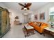 Spacious living room with orange sofa and eclectic decor at 20591 Monza Loop, Land O Lakes, FL 34638
