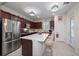 Modern kitchen with stainless steel appliances and island at 20591 Monza Loop, Land O Lakes, FL 34638