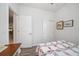Guest bedroom with double doors to closet and view into adjacent room at 20591 Monza Loop, Land O Lakes, FL 34638