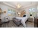 Spacious main bedroom with a large bed and plenty of natural light at 20591 Monza Loop, Land O Lakes, FL 34638