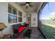 Relaxing screened porch with patio furniture and view of backyard at 20591 Monza Loop, Land O Lakes, FL 34638
