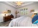 Spacious main bedroom with a large bed and plenty of natural light at 20591 Monza Loop, Land O Lakes, FL 34638