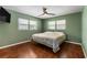 Bedroom with wood floors and a ceiling fan at 1811 Martin Rd, Dover, FL 33527