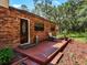 Brick home with side patio and lush landscaping at 1811 Martin Rd, Dover, FL 33527