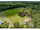 Aerial view of house and large lot with trees at 1811 Martin Rd, Dover, FL 33527