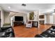 Open living room showcasing hardwood floors and comfortable furniture at 1811 Martin Rd, Dover, FL 33527