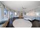 Grand main bedroom featuring a large bed, circular rug, and floor-to-ceiling windows at 100 Beach Ne Dr # 1900, St Petersburg, FL 33701
