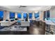 Luxury living room with stunning city views at night and modern furniture at 100 Beach Ne Dr # 1900, St Petersburg, FL 33701