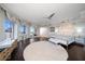 Spacious main bedroom with hardwood floors, large bed, and access to a balcony at 100 Beach Ne Dr # 1900, St Petersburg, FL 33701