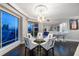 Bright dining room with city views and modern chandelier at 100 Beach Ne Dr # 1900, St Petersburg, FL 33701