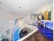 Open upper landing with glass railings overlooking a modern staircase at 100 Beach Ne Dr # 1900, St Petersburg, FL 33701