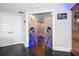 Elegant bathroom entry with glass doors and blue accent lighting at 100 Beach Ne Dr # 1900, St Petersburg, FL 33701